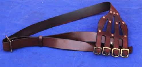 Baldric made from natural shoulder veg tanned hide 3-4 mm .4  Brass buckles for fastening Scabbard. Large brass buckle on the front. Brown leather.