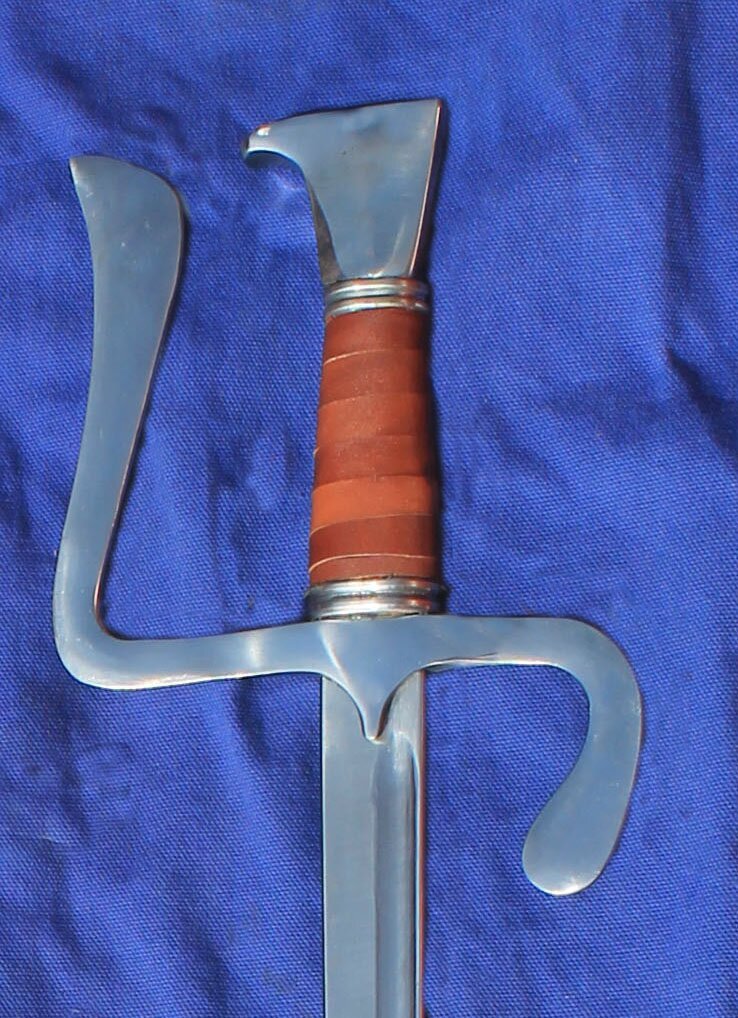 15th Century Falchions with single edged fullered blade
						Leather grip as standard.
						Blade dimensions available
						Blade 76cm 3.8cm at hilt tapering to 2.5cm at tip
						Blade 66cm 5cm at hilt tapering to 2.5 cm at tip