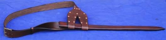 Baldric. Made from veg. tanned natural shoulder hide 3-4 mm thick. Large brass buckle on the front. Sleeve to hold the scabbard.
