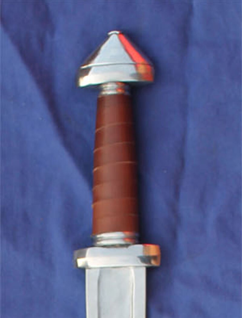 Viking sword with short crossguard & pommel referred to as a cocked hat 8th-9th Century.
						Reenactment wide fuller in picture.
						Leather grip as standard.
						Various blade dimensions available please confirm when ordering - 
						
						1.               66cm Blade  5cm Hilt  2.5cm Tip
						2.	76cm Blade  5cm Hilt  2.5cm Tip
						3.	76cm Blade  5cm Hilt  1.9cm Tip
						4.	76cm Blade  3.8cm Hilt  2.5cm Tip
						5.	76cm Blade  3.8cm Hilt 1.9cm Tip
						