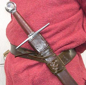 Leather waist belt with split belt lacing to angle scabbard. Sword shown worn angled at the hip.