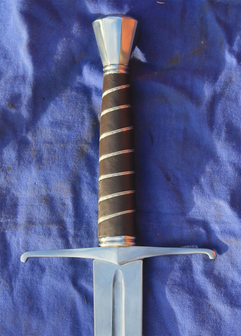 14th-15th Century Medieval Hand and a Half sword with leather grip bound in wire. Octagonal pommel and quillons with drooped terminals
						Blade dimensions available 
						Diamomd section blade 89cm 3.8cm at hilt tapering to 1.9cm at tip
						Blade 89cm 5cm at hilt tapering to 2.5 cm at tip