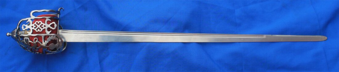 Thistle basket, silver hilt with thistle guards, and sharp back edged blade